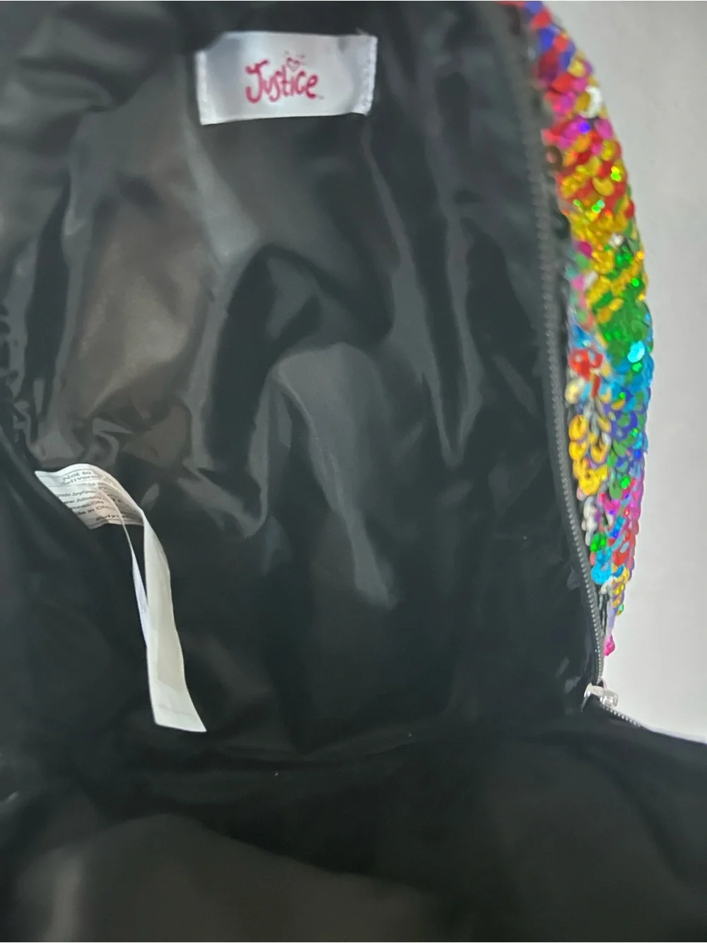 Justice Rainbow Sequin Backpack with Yellow Emoji and Pink Pom